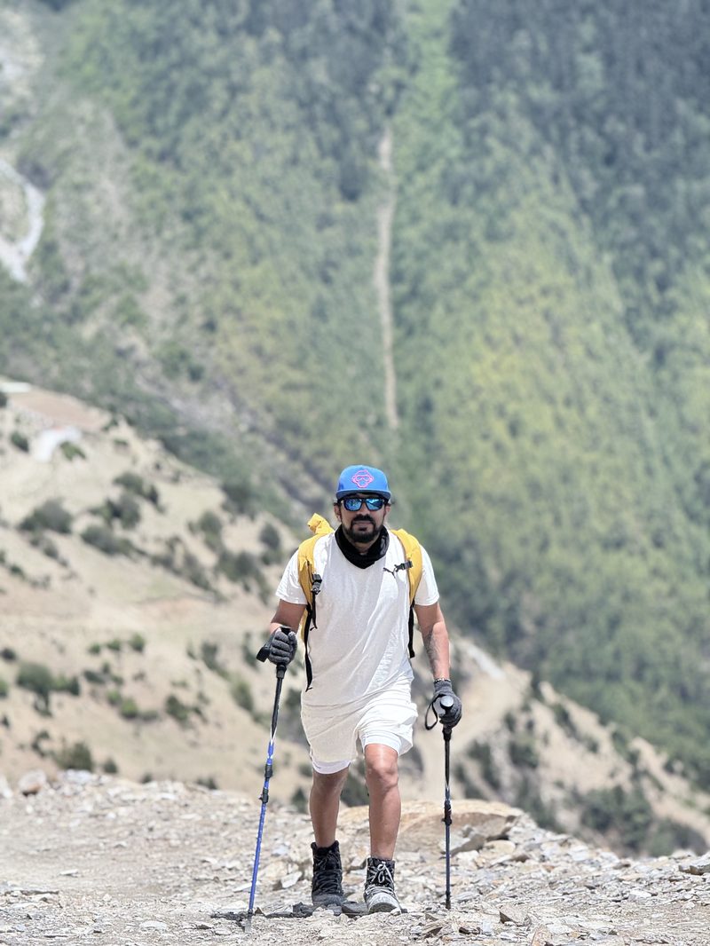 Trekking with poles on a mountain trail